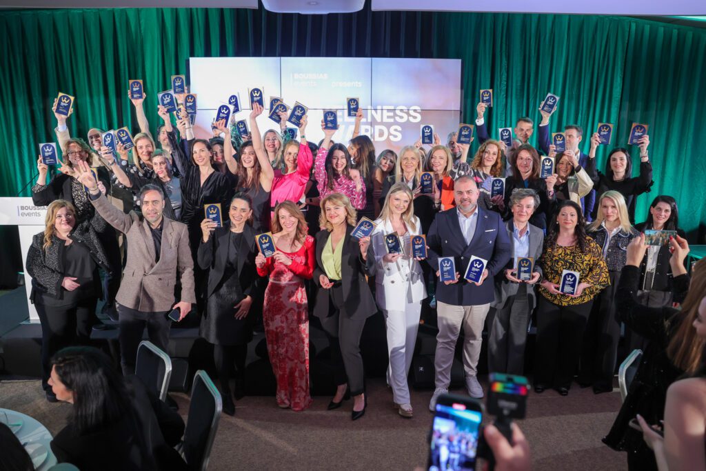 Group of award winners celebrating on stage at the Wellness Awards 2025
